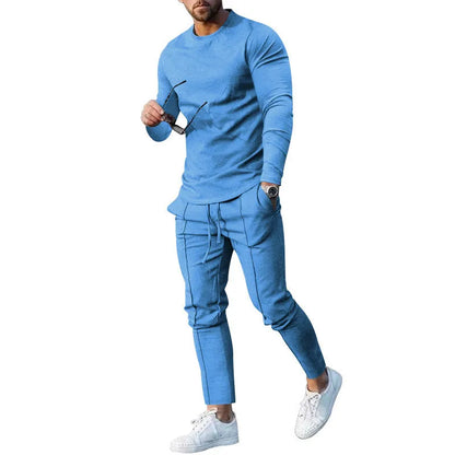 Men's solid colour two-piece lounge suit with long sleeve T-shirt and trousers in light grey.