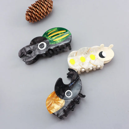 Handmade cellulose acetate beetle grip with caterpillar element in cartoon style decorative clip