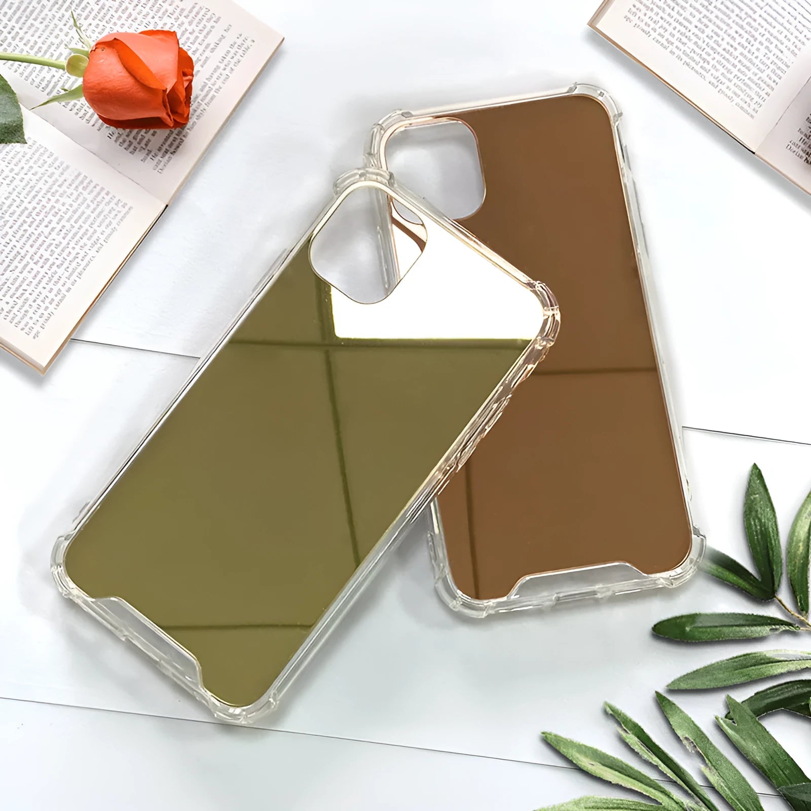 Silver mirrored phone case for Apple iPhone on a table, showing reflective back.