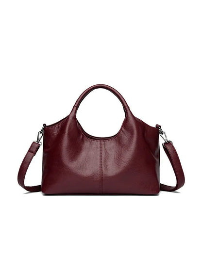 Women's soft genuine leather large crossbody bag shown in available colours: black, brown, wine red, yellow, beige, bronze, green.