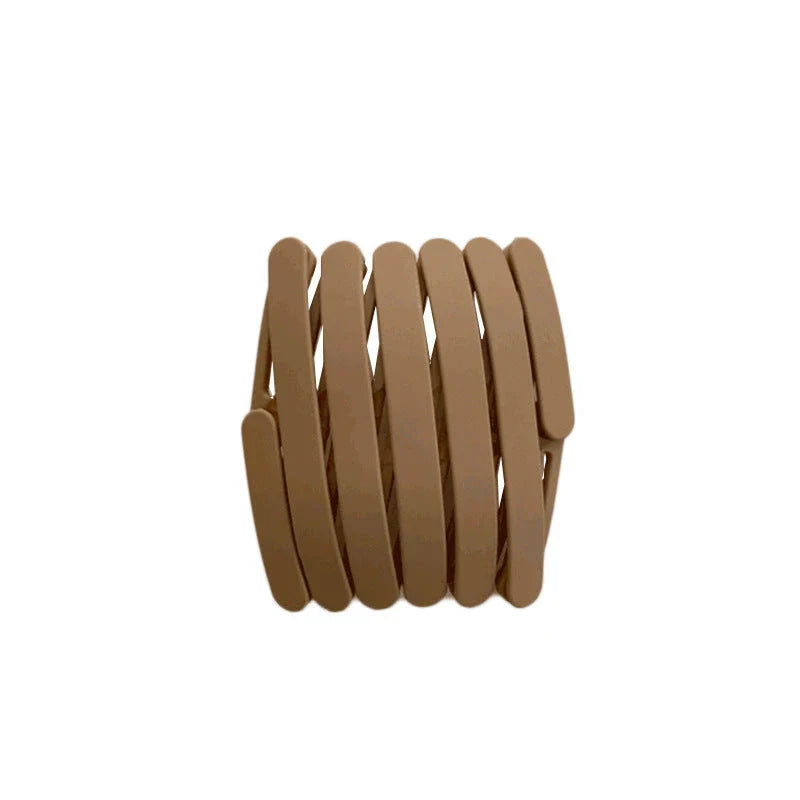 Compact retractable hair band with non-slip teeth grip, available in various colors for versatile styling