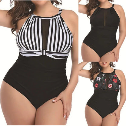 Women's black one-piece swimsuit with lace trim on display, showing front design and fabric detail.