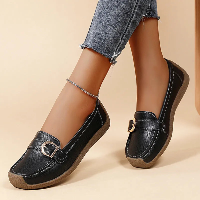 Women's beige casual loafers with a round toe and shallow-cut vamp on a beef tendon sole.