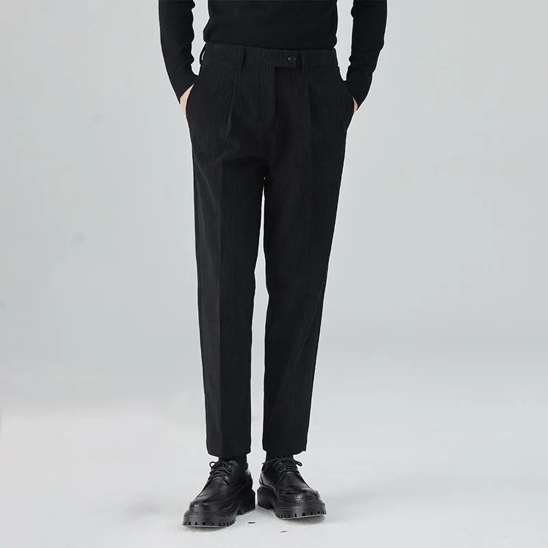 Men's straight-leg corduroy trousers in beige colour showing elastic waistband and loose fit