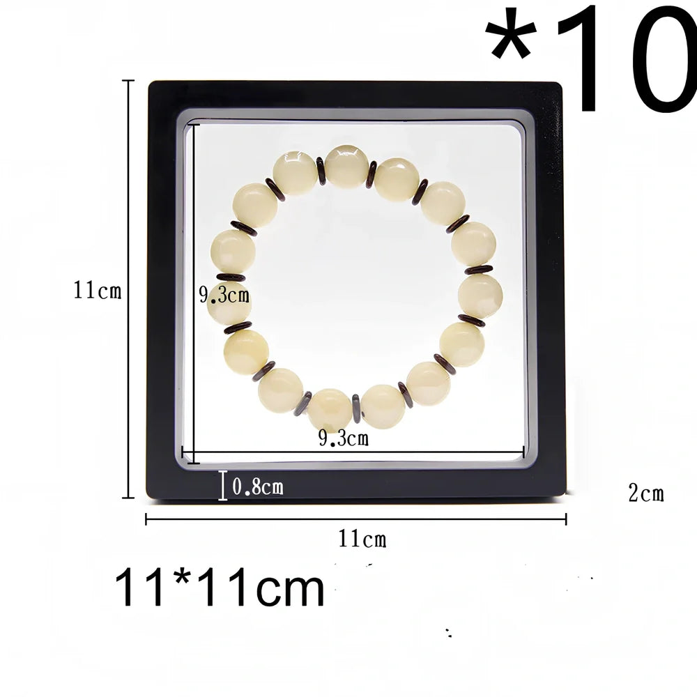 Black 11x11cm suspended 3D floating display frame holding a coin, with square base for stable collectible showcase
