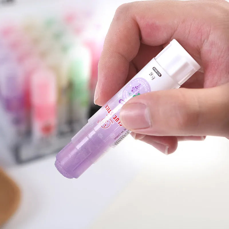 Jelly solid glue stick with fruit scent, 8.5 cm long, for student and craft use.