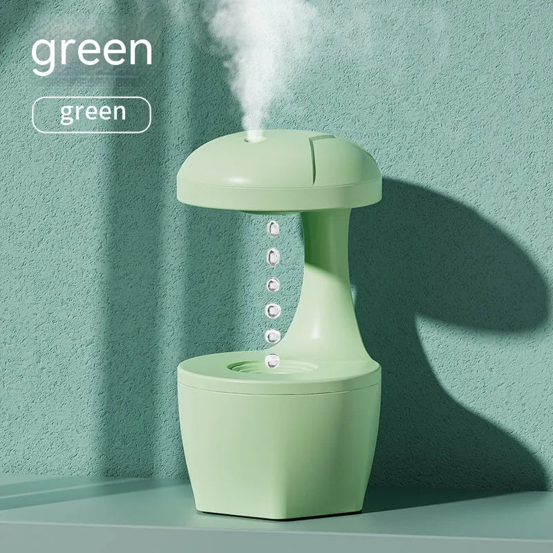 White, pink, and green column-shaped USB-powered ultrasonic humidifier.