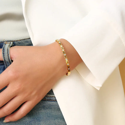 Korean style titanium steel bracelet with a numerical design element on an adjustable band.