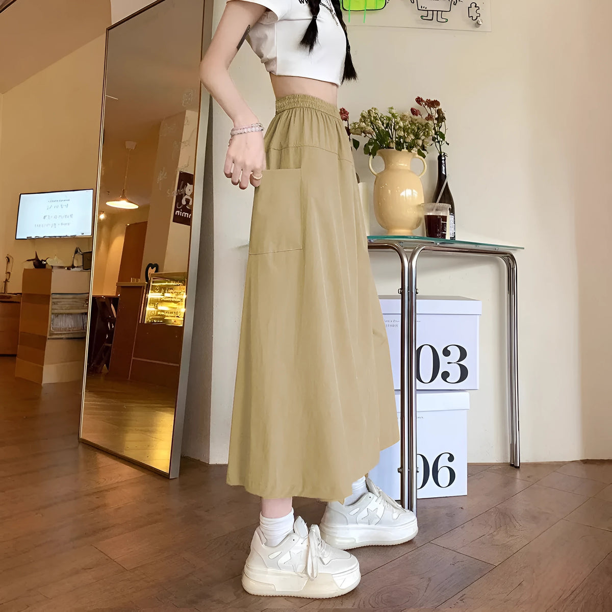 Women's camel coloured wide leg cropped skirt with elastic waistband and drape detailing