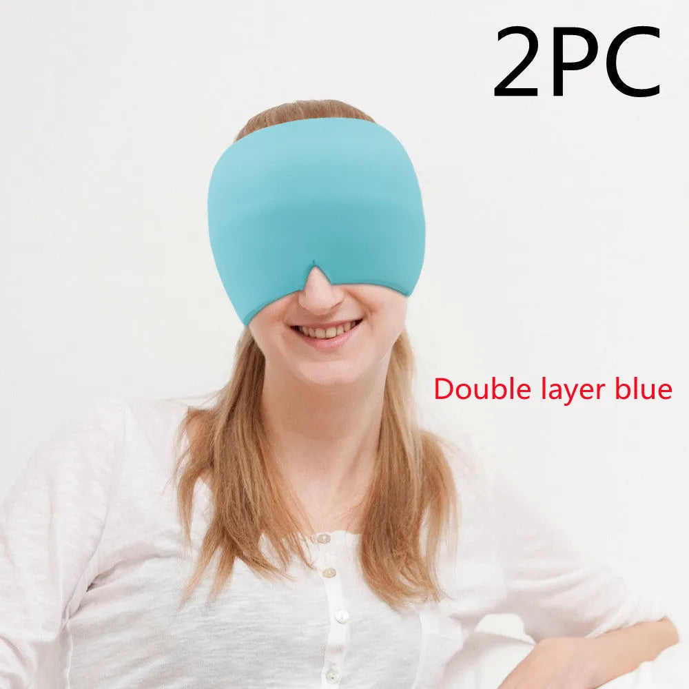 Black elastic cloth gel cold compress eye mask for headache relief on a grey background.