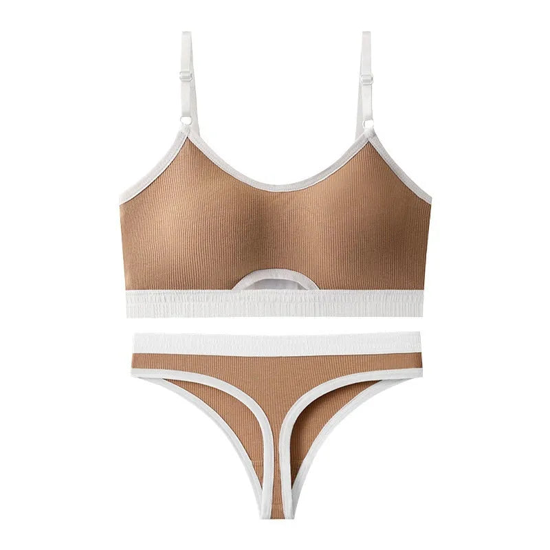 White underwired sports bra set with contrast dark grey back detailing and matching briefs on a mannequin.
