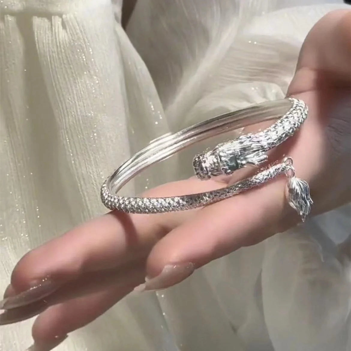 Adjustable Chinese dragon tail bangle with intricate relief design