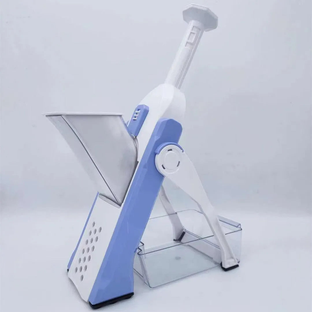 Orange multifunctional vegetable cutter kitchen tool with mandoline blades on a countertop.