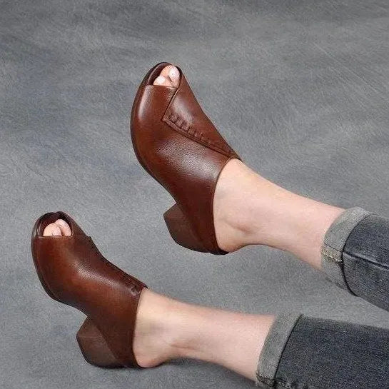 Women's black square heel peep-toe slippers with a rubber sole and fish mouth scaffold design.