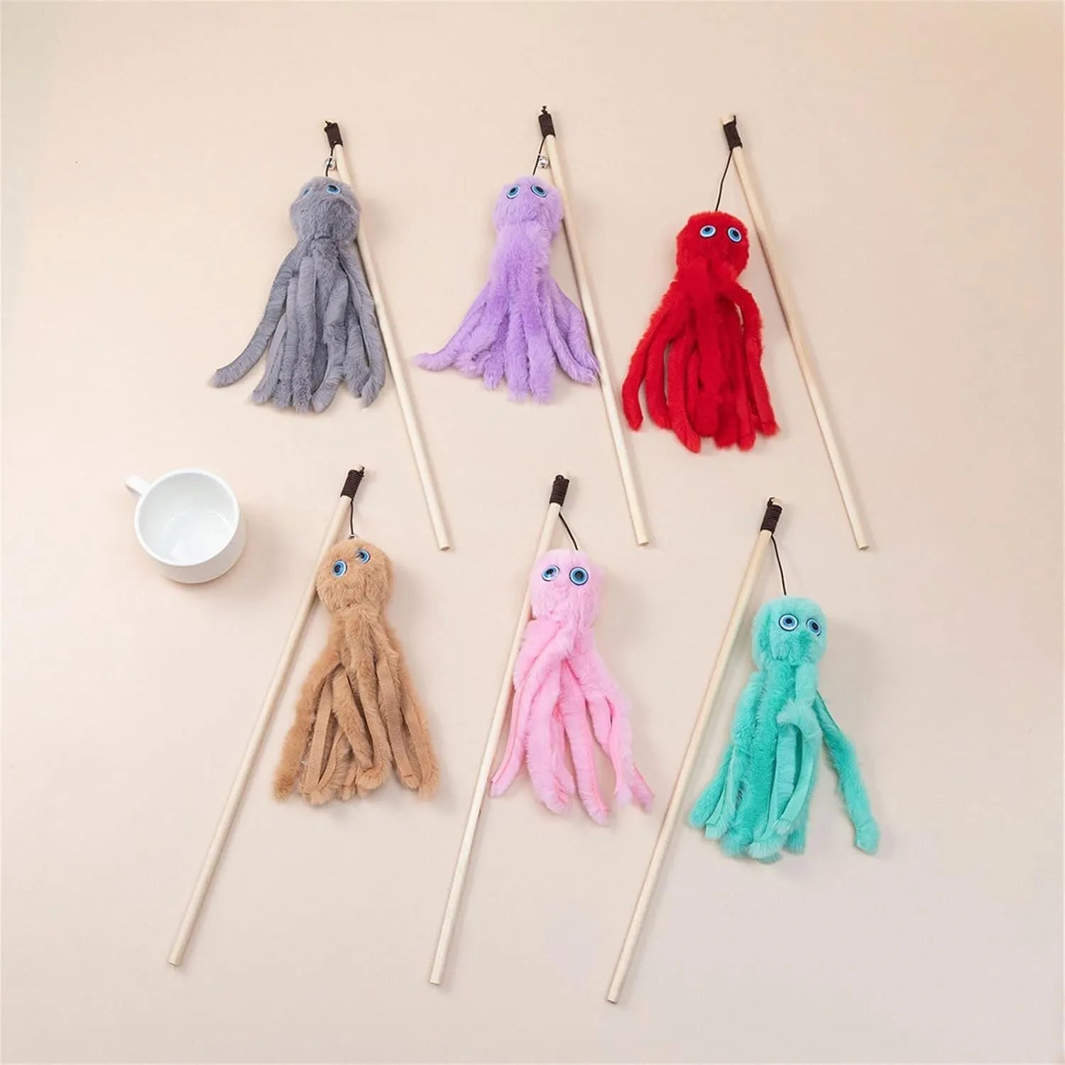 Octopus-themed furry cat toy attached to a long stick, shown in pink colour.