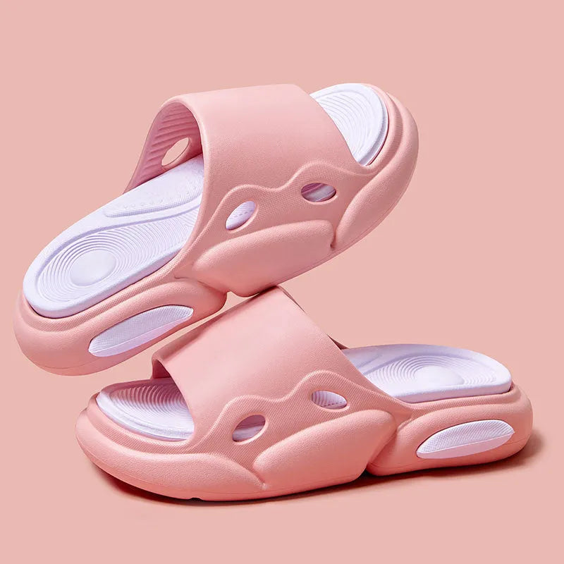 Pair of two-tone thick-soled EVA slippers with a leather lining, shown in pink and purple.