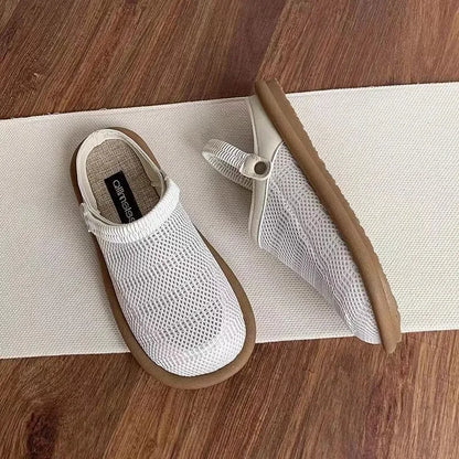 Breathable linen slip-on hole shoes in milky white colour with mesh lining and rubber sole.