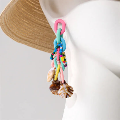 Handmade bohemian shell tassel earrings for women with colourful flower and geometric drop design
