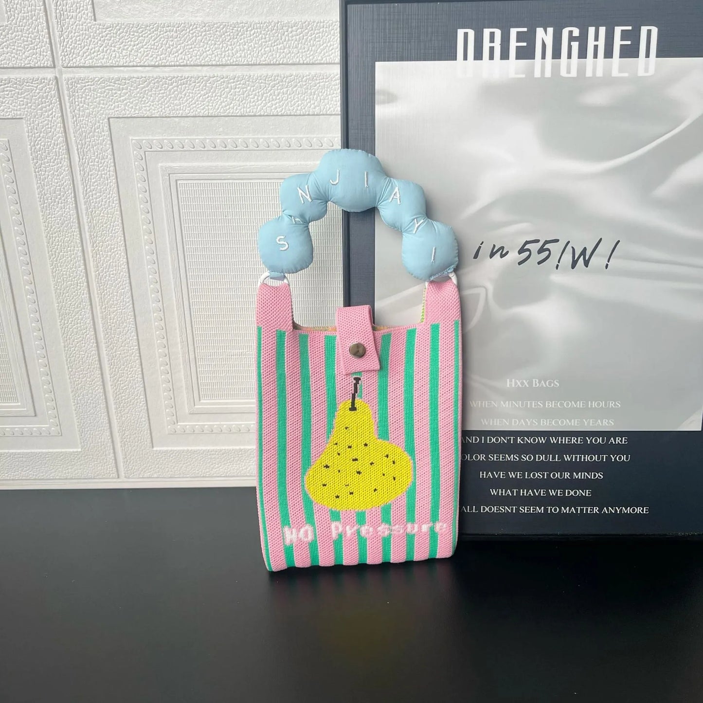 Cartoon knitted messenger bag with polyester construction and internal mobile phone storage