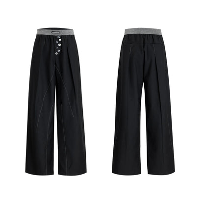 Straight-leg trousers with button-open line detail in black and grey colours, showing high-waist design and tailored silhouette