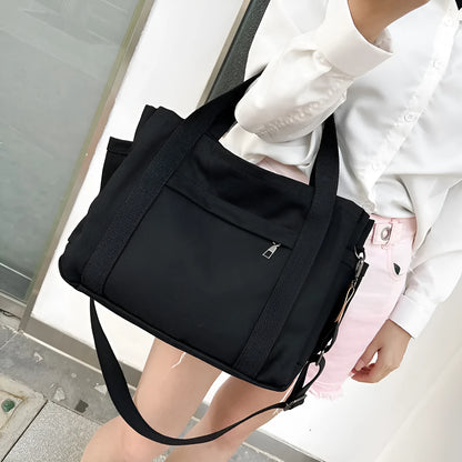 Large canvas tote bag in horizontal square shape with open-zip sides and internal organisers
