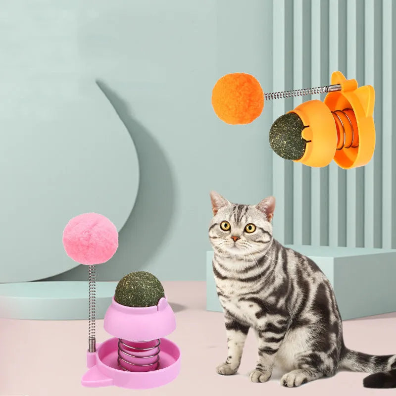 Blue, orange, and pink 55mm lickable mint ball cat toy for dental care and boredom relief.