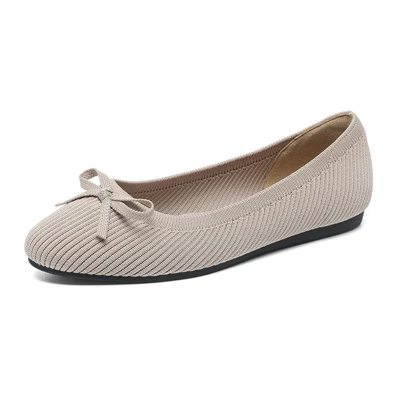 Women's round toe flat pumps with bow detail in butterfly colours showing fabric upper and shallow mouth opening
