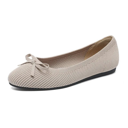 Women's round toe flat pumps with bow detail in butterfly colours showing fabric upper and shallow mouth opening