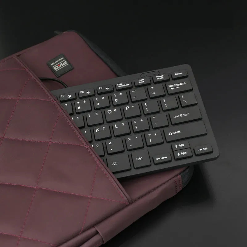 USB wired mini keyboard in four colour options showing compact 280mm design