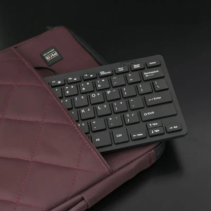 USB wired mini keyboard in four colour options showing compact 280mm design