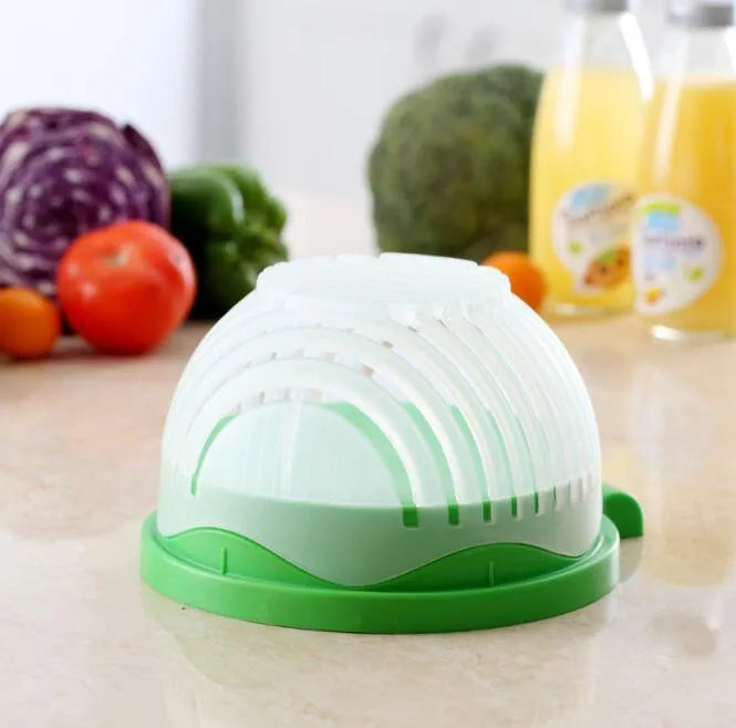 Blue salad cutter bowl showing cutting lid with seams, drain basket function, and reversible base plate