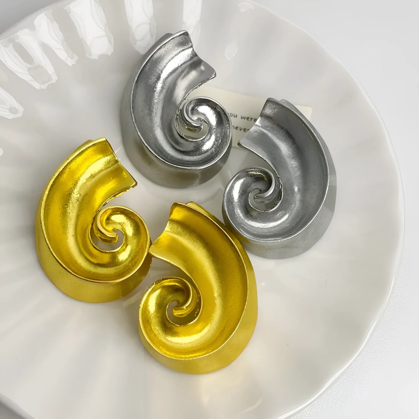 Gold and silver retro geometric alloy ear studs on a white background.