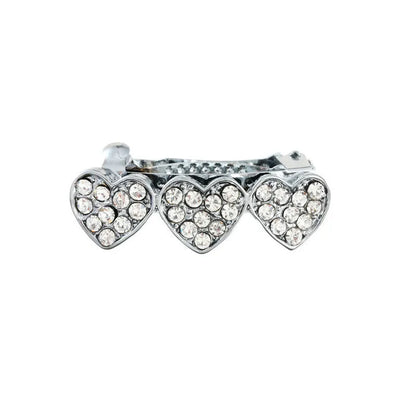 A 3cm long peach heart shaped hair clip with rhinestones and a small dog charm, on a white background.