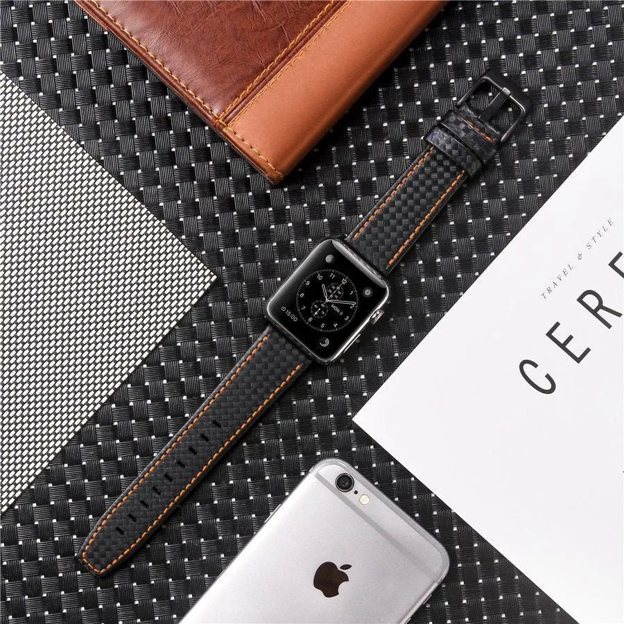 Leather Apple Watch strap with carbon fibre pattern case in red, black, orange, and blue colour options.