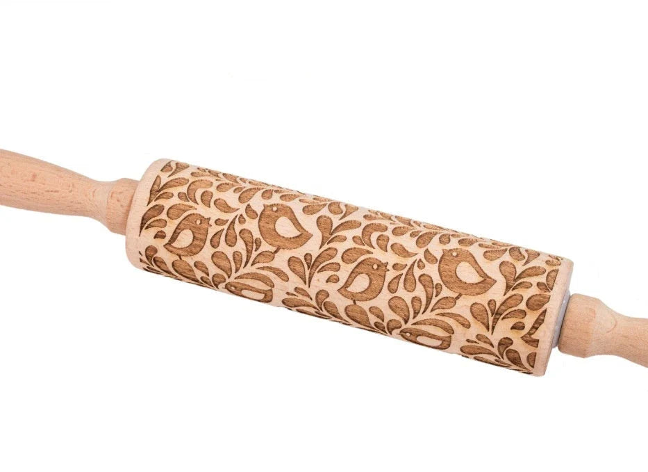 Festive rolling pin with embossed Christmas designs for easy imprinting on dough