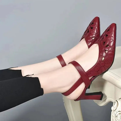 Red women's pointed toe backless sandals with a hollowed toe box and rubber sole