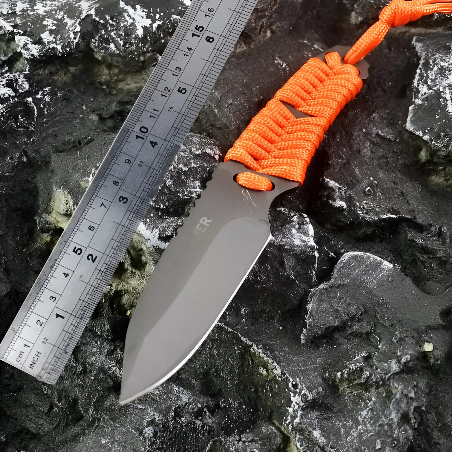 Straight-blade survival knife with a binding rope handle next to its black ABS plastic sheath.