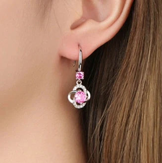 Silver stud earrings with four-leaf clover design and fairy ear hooks