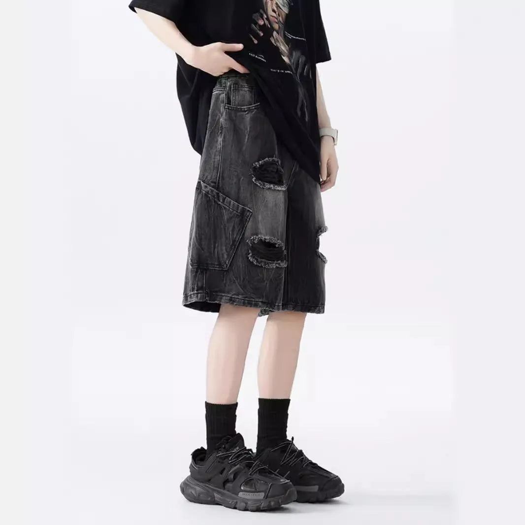 Mens loose fit ripped denim shorts in washed blue and black retro style