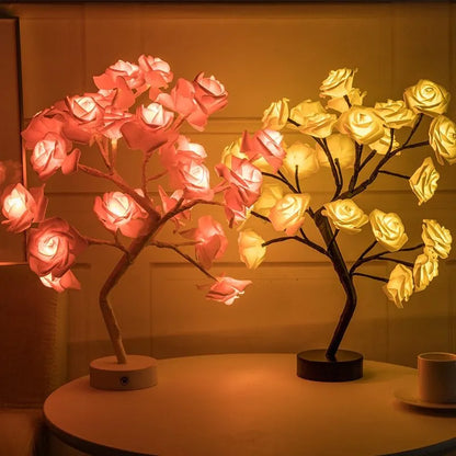 White and red rose flower LED lamp on a table with bonsai tree shape and warm white glow.