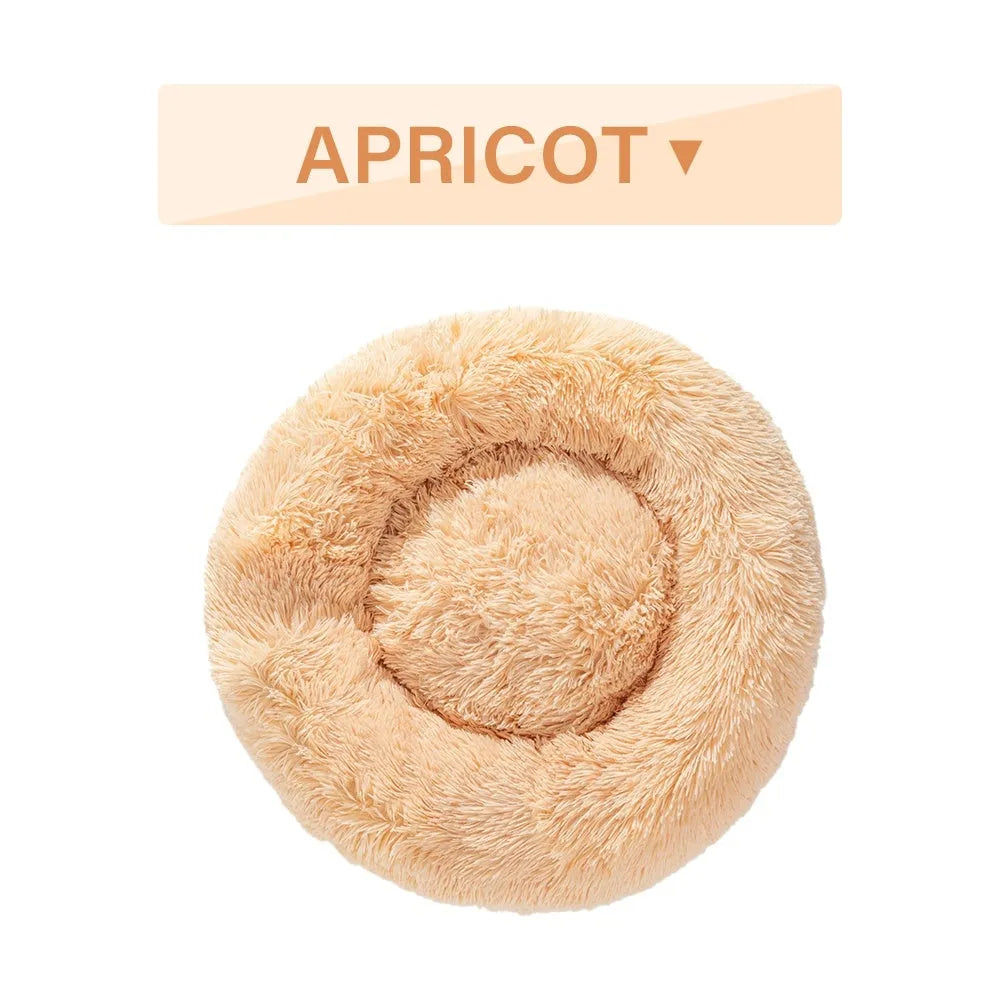 Fluffy donut-shaped pet bed with raised bolster edge in long plush material