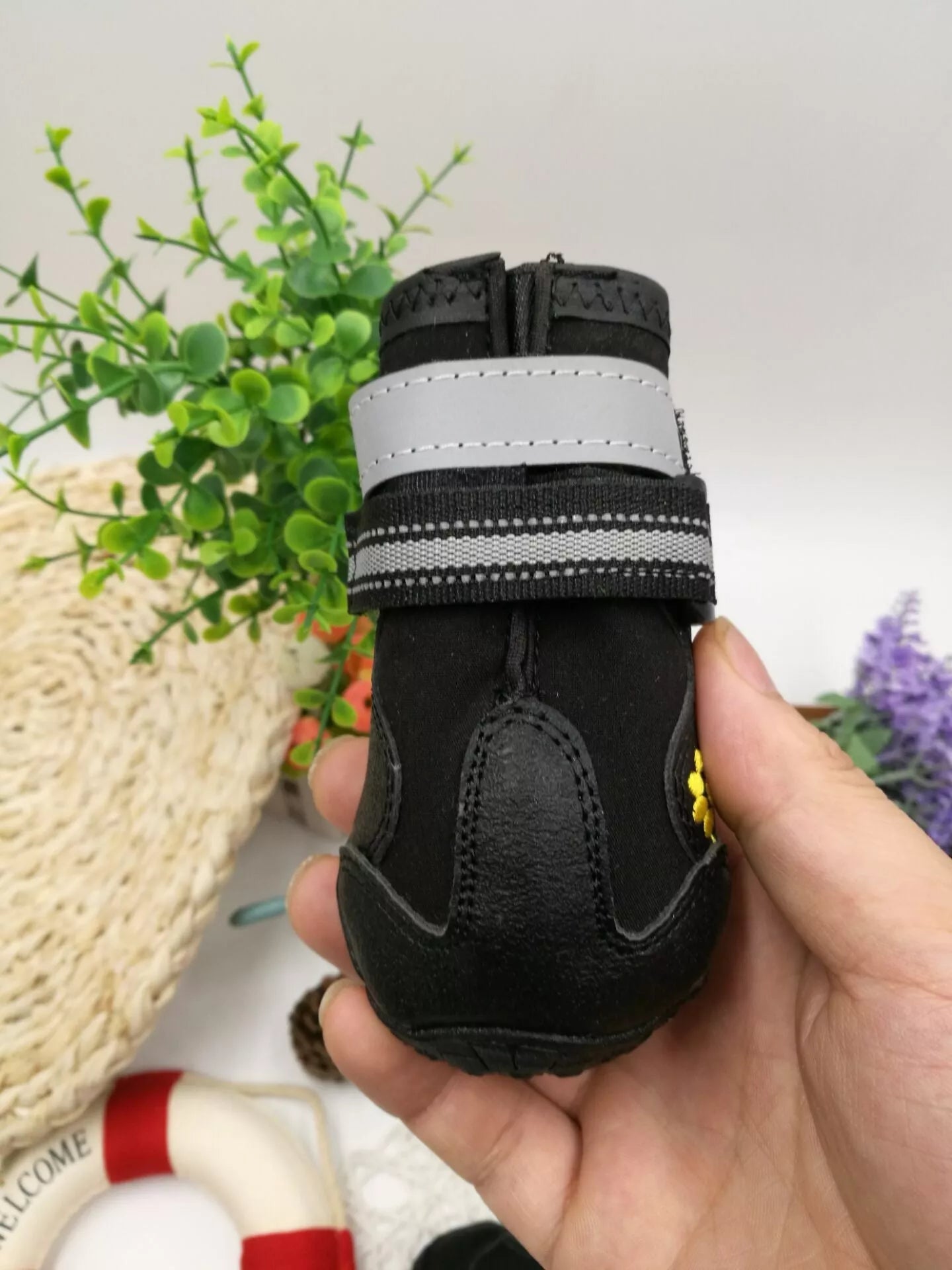 Black waterproof dog shoes with non-slip soles and adjustable fuzzy belt