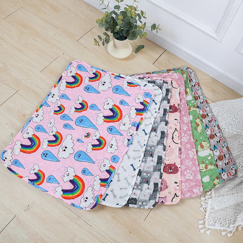 Reusable washable pet urine pad showing colourful animal pattern and waterproof backing.