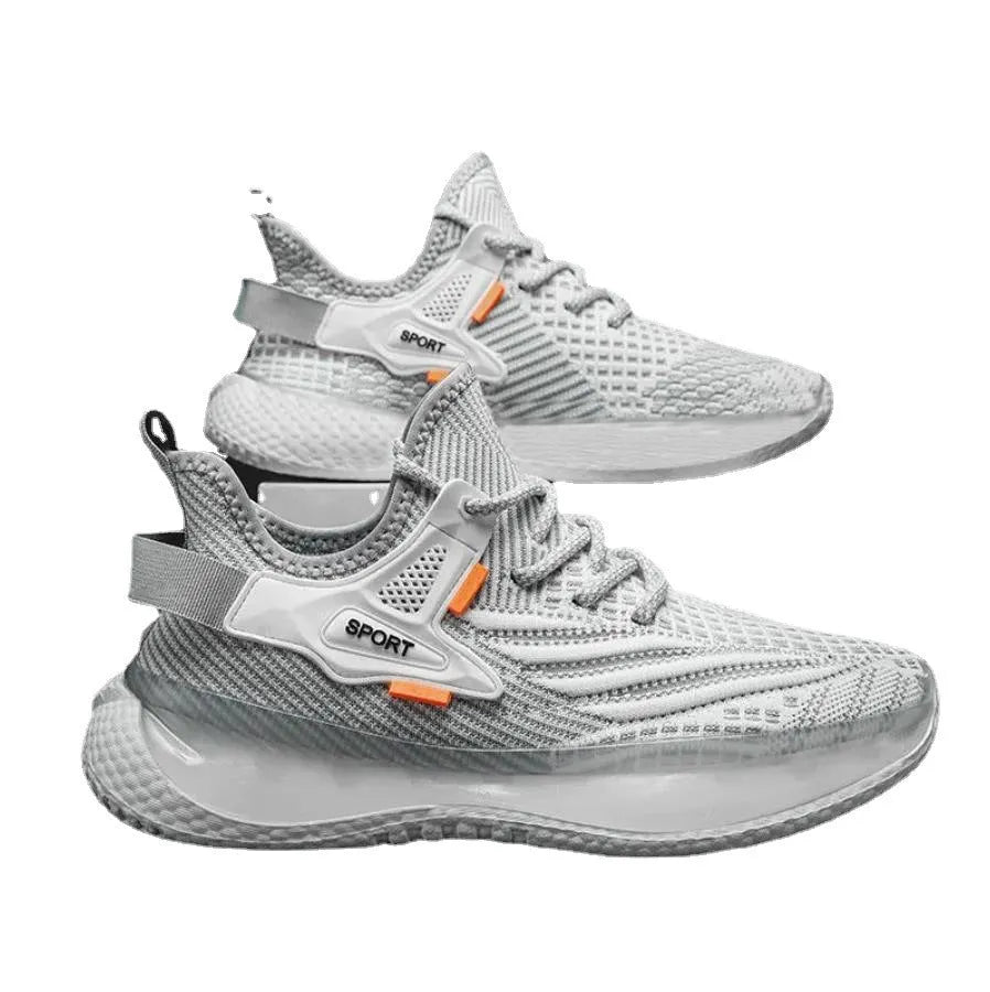 Men's white low-top sneakers with mesh upper and flat rubber sole on a grey background.