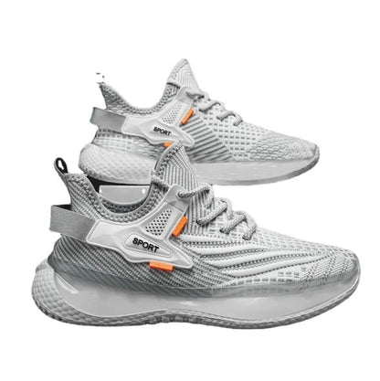 Men's white low-top sneakers with mesh upper and flat rubber sole on a grey background.