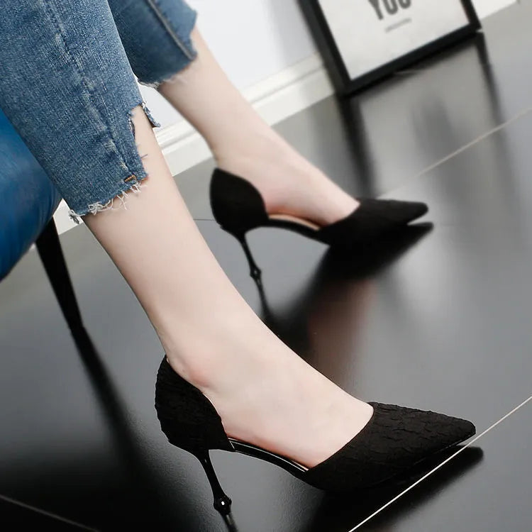 Women's black pointed toe stiletto heel sandals on a white background.