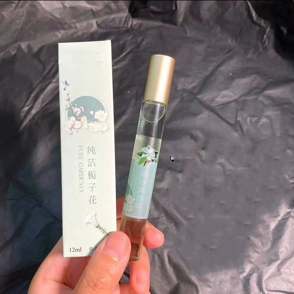 12ml glass rollerball essential oil fragrance bottle with Pure Gardenia label, featuring metal applicator for subtle scent application