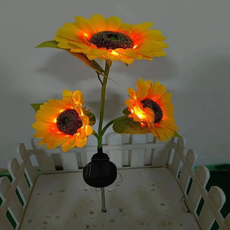 Colourful solar-powered LED lawn lamp in a flower shape for garden decoration.