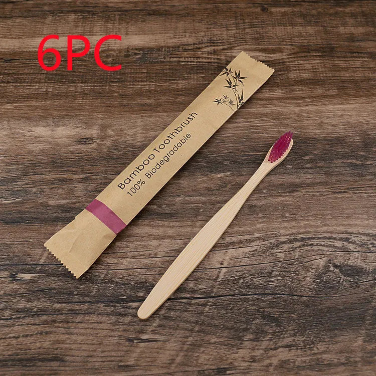 10 natural bamboo toothbrushes with charcoal bristles in six colours showing 17.5cm length