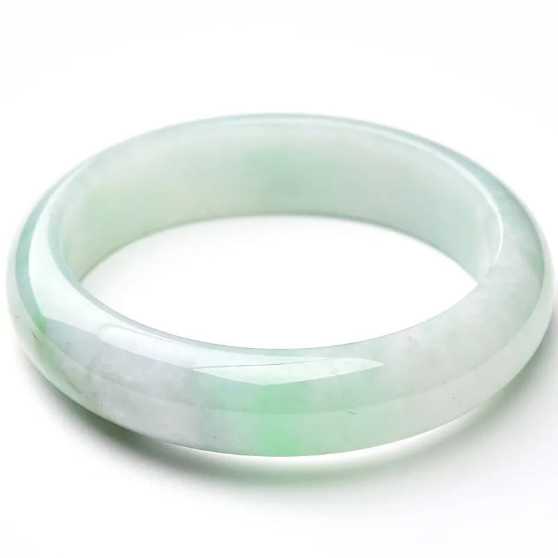 Light green jade stone bracelet showing natural mineral texture on wrist